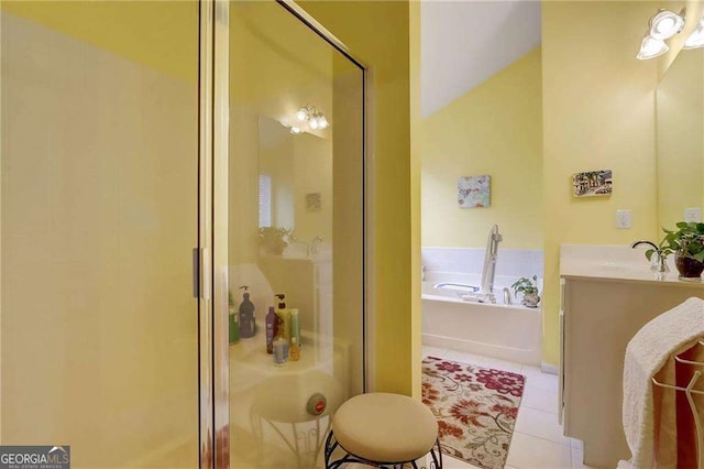 bathroom featuring tile patterned floors, plus walk in shower, and vanity