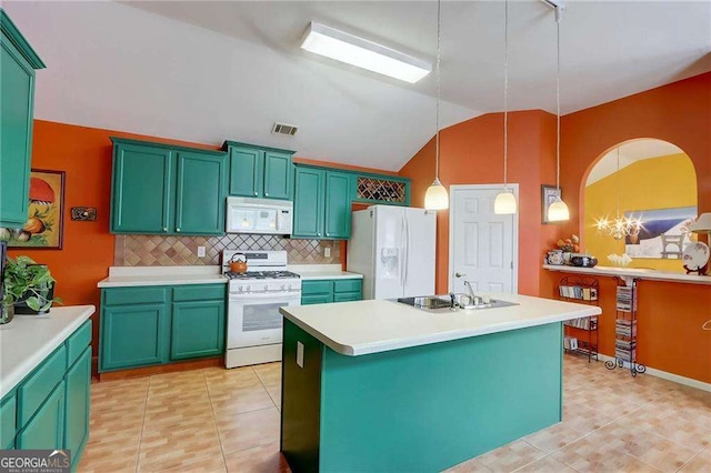 kitchen featuring a kitchen island, tasteful backsplash, sink, hanging light fixtures, and white appliances