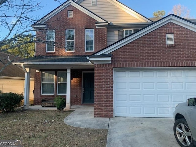 front facade featuring a porch and a garage