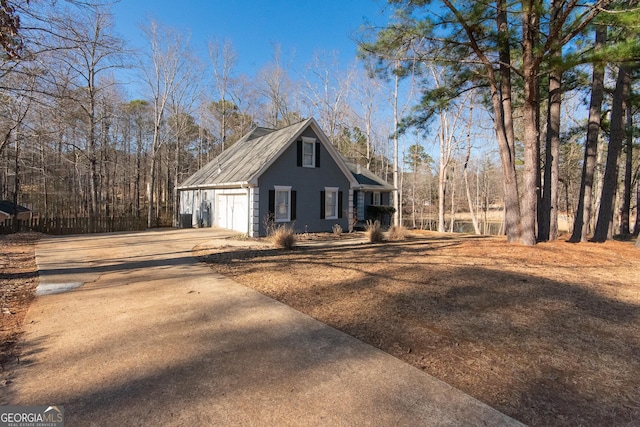 view of side of property with driveway