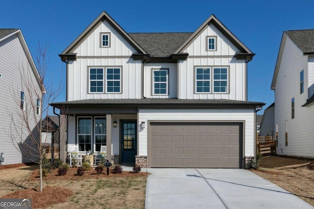 view of front of property with a garage and a porch