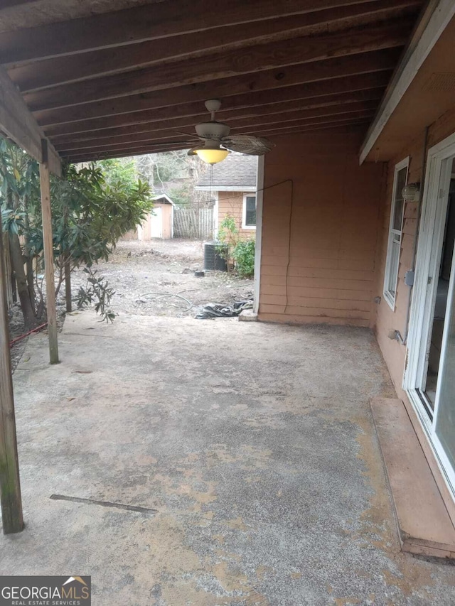 view of patio / terrace featuring a shed and ceiling fan