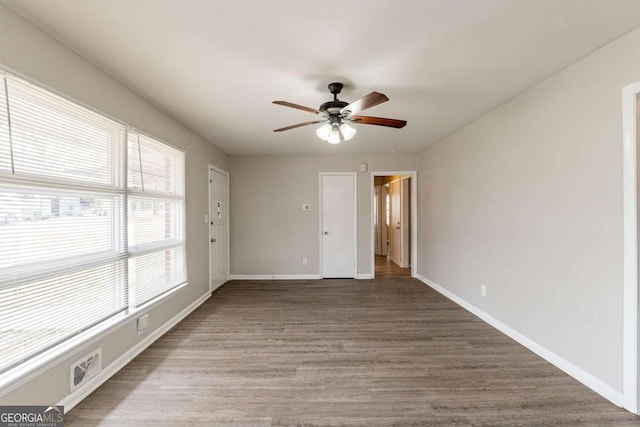 unfurnished room with hardwood / wood-style flooring and ceiling fan