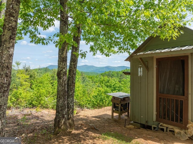 exterior space featuring a mountain view and a shed