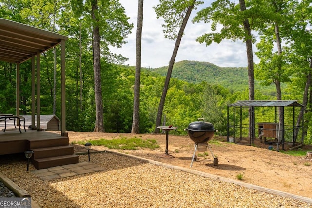 view of property's community with a deck with mountain view