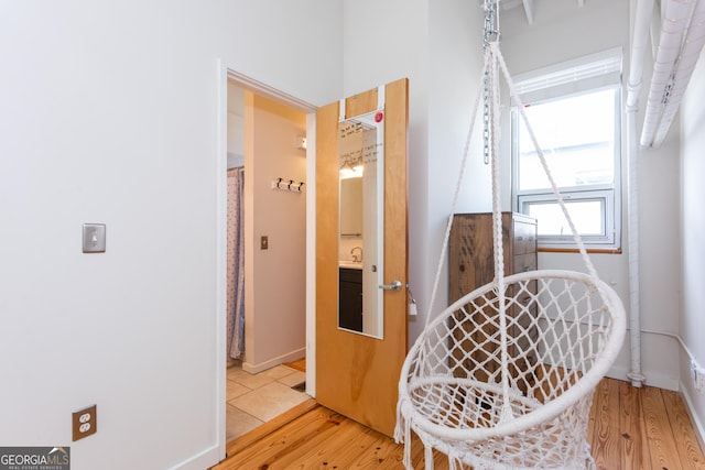 1661 La France St NE Unit 216, Atlanta, GA 30307 - hall featuring light wood finished floors and baseboards