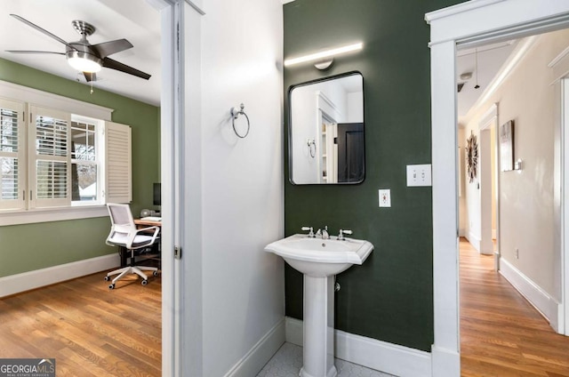 bathroom with wood-type flooring and ceiling fan