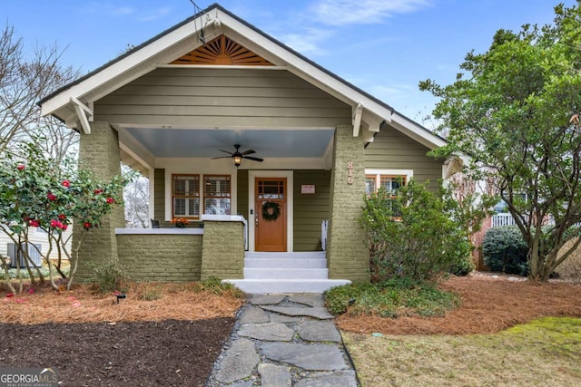 view of front of home with ceiling fan and covered porch