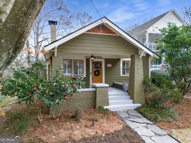 bungalow-style house featuring ceiling fan and covered porch