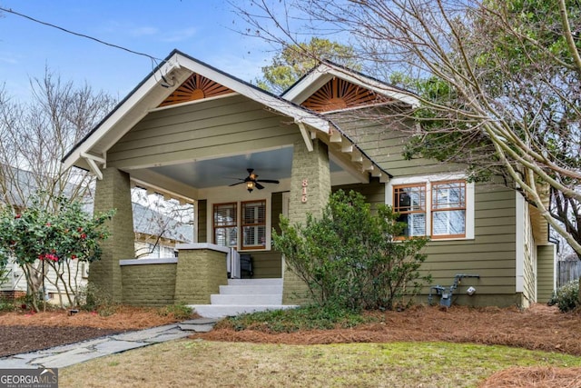 craftsman-style house featuring ceiling fan and a porch