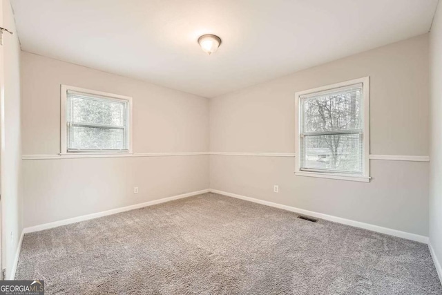 spare room featuring carpet flooring