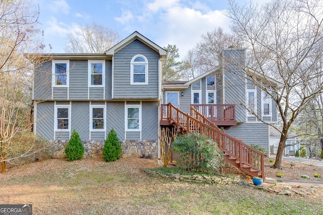 rear view of property with a deck