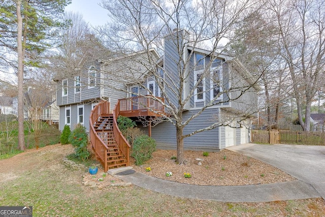 view of front of property with a wooden deck and a garage