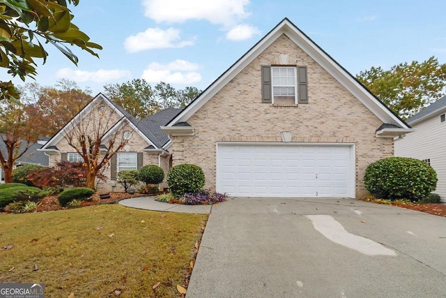 view of front property with a garage and a front lawn