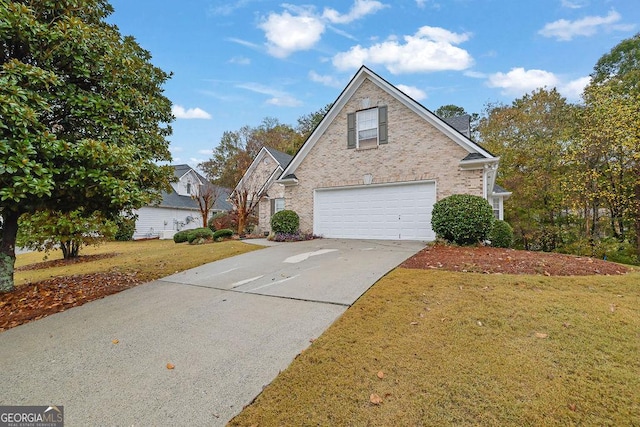 front of property featuring a garage and a front lawn