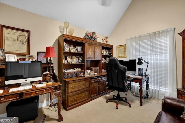 carpeted office featuring high vaulted ceiling