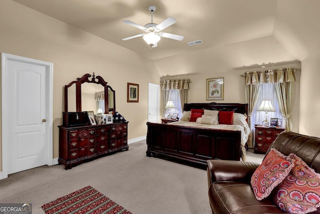 bedroom featuring light carpet, vaulted ceiling, and ceiling fan