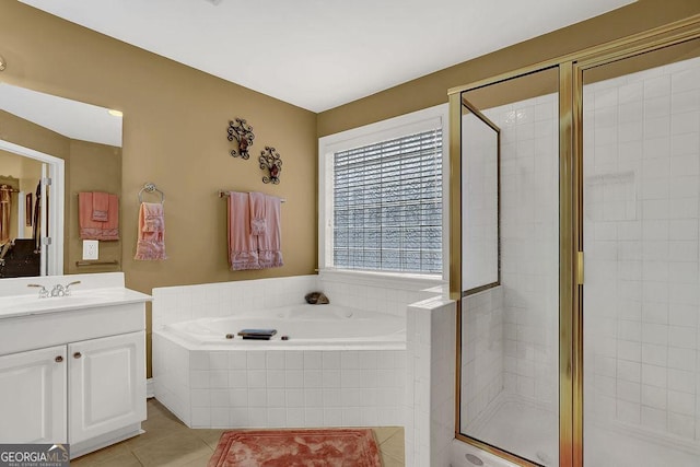 bathroom with vanity, tile patterned floors, and separate shower and tub