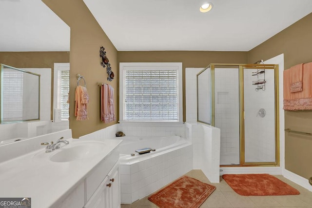 bathroom featuring vanity, separate shower and tub, and tile patterned floors