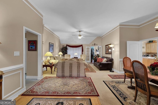 bedroom with ceiling fan, lofted ceiling, and ornamental molding