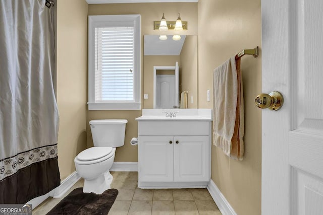 bathroom featuring tile patterned floors, toilet, and vanity