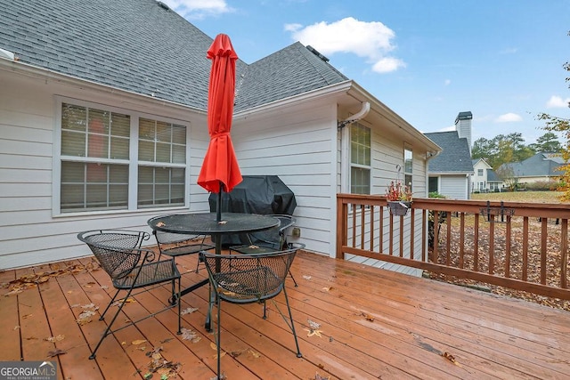 wooden deck with area for grilling