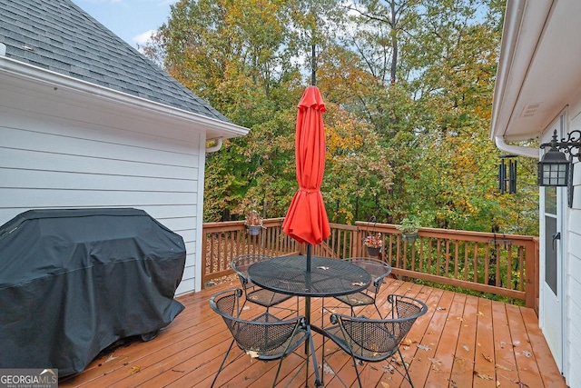 wooden deck with grilling area