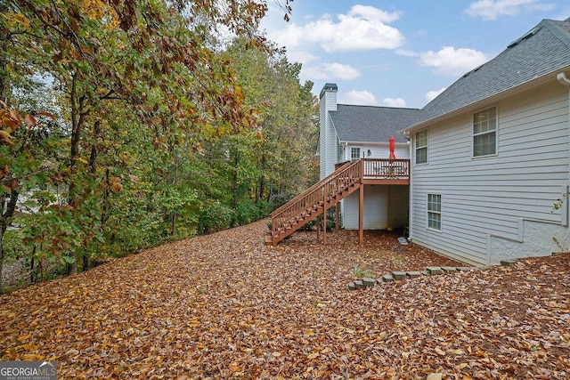 view of yard with a wooden deck