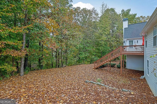 view of yard with a wooden deck