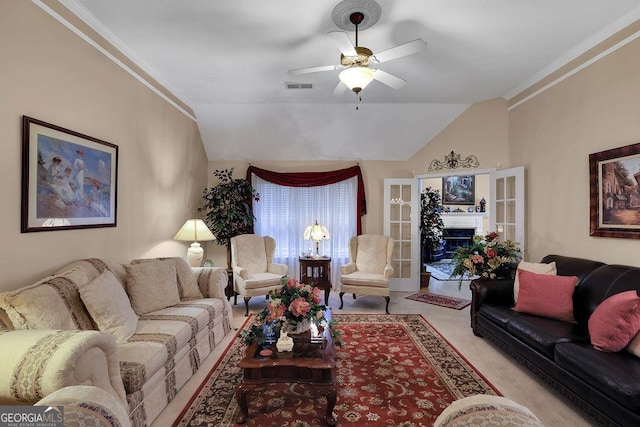 carpeted living room featuring french doors, ceiling fan, ornamental molding, and vaulted ceiling