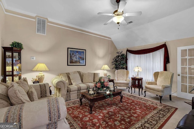 carpeted living room with crown molding, ceiling fan, and vaulted ceiling