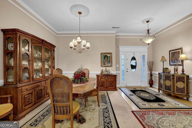 dining space featuring crown molding and a notable chandelier