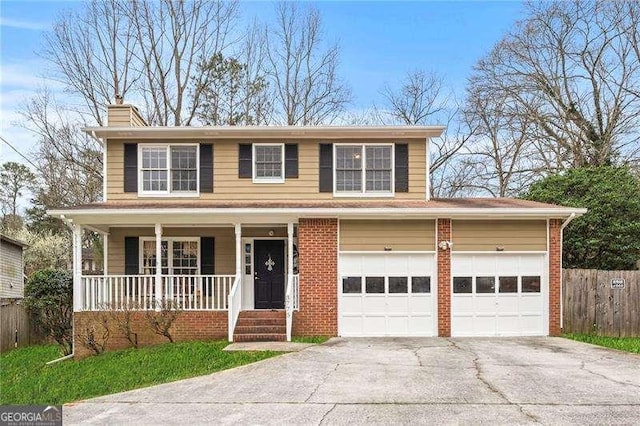 view of front of house with a garage and covered porch