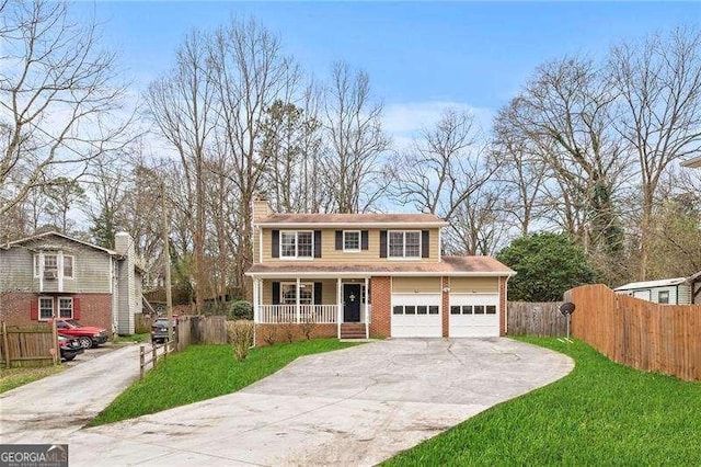 view of front of home featuring a garage, a porch, and a front lawn