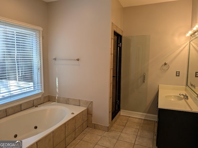 bathroom with vanity, plus walk in shower, and tile patterned flooring