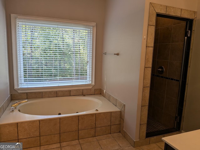 bathroom with shower with separate bathtub, tile patterned floors, and vanity