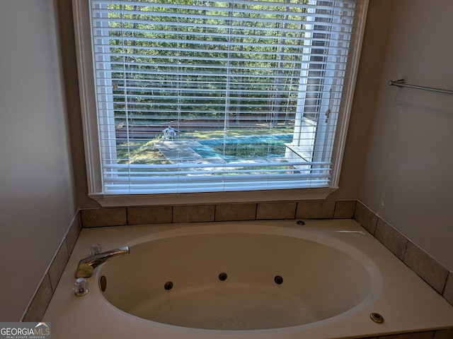 bathroom with a tub to relax in