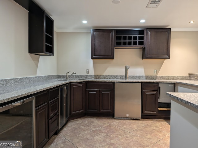 kitchen with stainless steel refrigerator, beverage cooler, sink, and crown molding