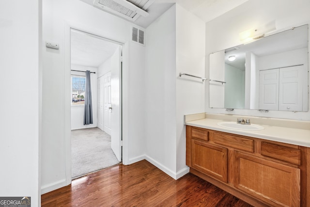 1625 Conley Rd Unit 270, Conley, GA 30288 - bathroom with wood finished floors, vanity, and baseboards