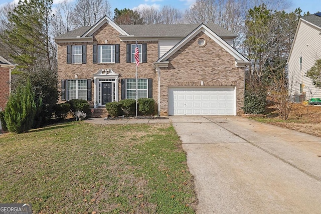 view of front of home with a garage, a front yard, and central air condition unit