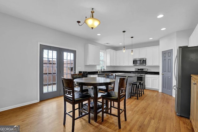 dining space featuring light hardwood / wood-style flooring