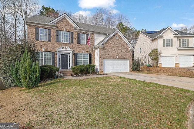 view of front facade with a garage and a front lawn