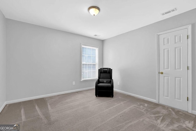 unfurnished room with light carpet