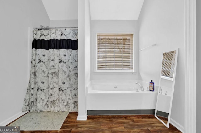 bathroom with separate shower and tub and hardwood / wood-style floors