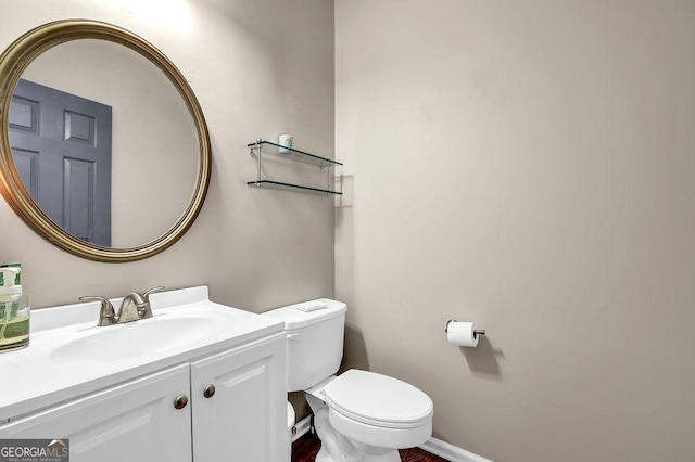 bathroom with vanity and toilet