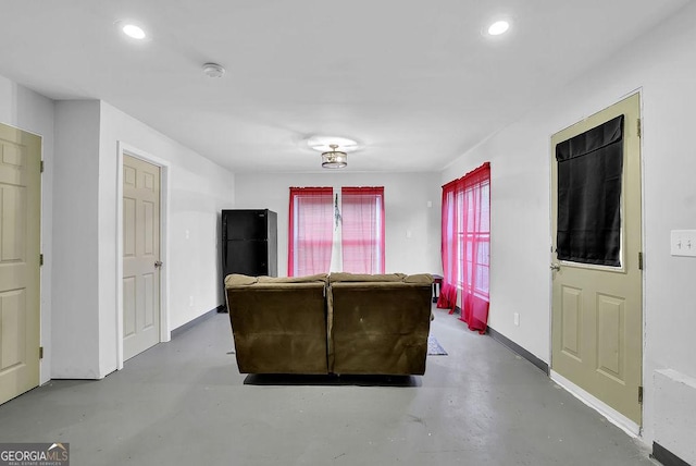 living room featuring concrete floors