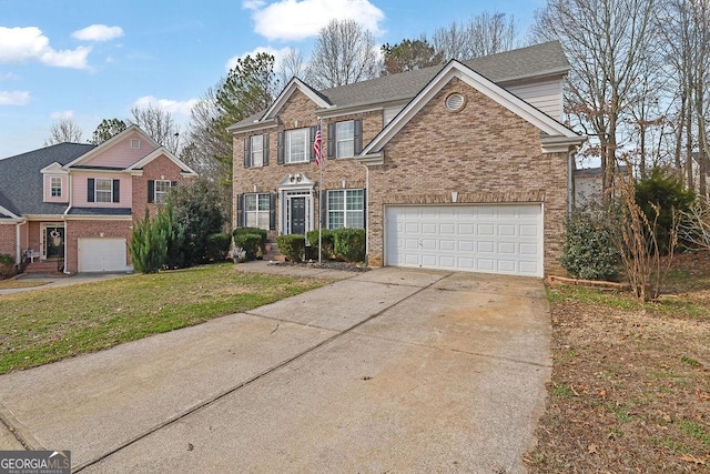 view of front of home with a garage and a front lawn