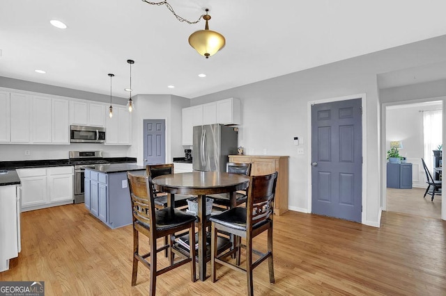 dining space featuring light hardwood / wood-style flooring