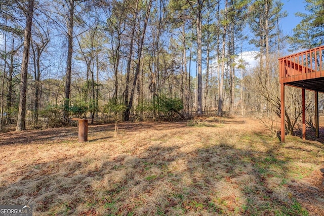 view of yard featuring a wooden deck