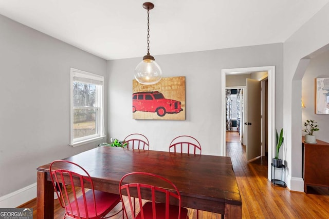 dining area with hardwood / wood-style floors